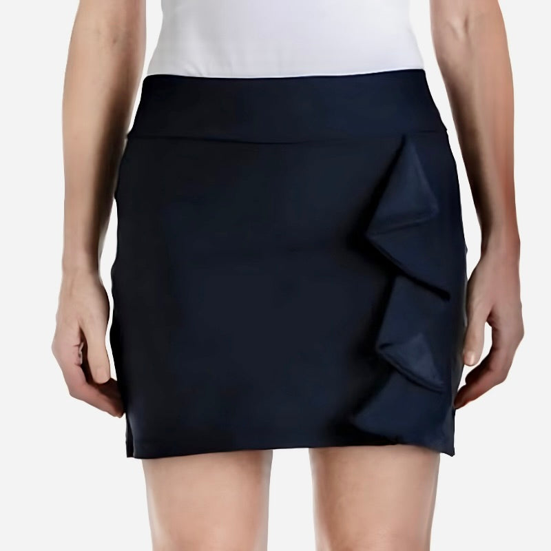Navy blue skirt with ruffle detail worn by a person on a white background