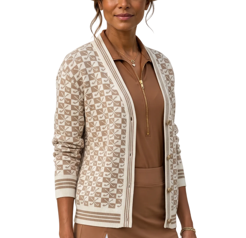 Woman wearing a patterned cardigan over a brown top and skirt with a beige hat.