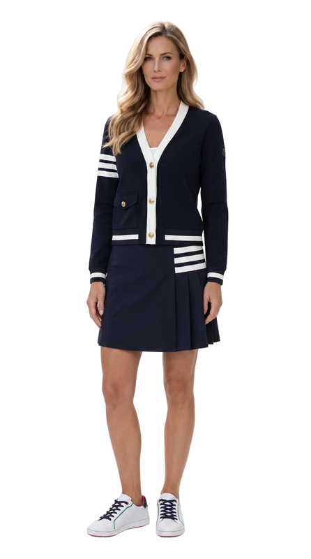 Woman wearing a navy cardigan with white stripes and a matching skirt on a white background